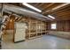 Unfinished basement area with exposed ceiling, painted floor and room for storage and projects at 4814 Riveredge Cv, Snellville, GA 30039