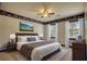 Inviting bedroom with a comfortable bed, mountain view art, and sports themed border at 4814 Riveredge Cv, Snellville, GA 30039
