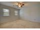 Neutral bedroom with carpet, ceiling fan and natural light from two windows with blinds at 4814 Riveredge Cv, Snellville, GA 30039