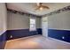 Cozy bedroom with unique wallpaper and a window offering a serene view at 4814 Riveredge Cv, Snellville, GA 30039
