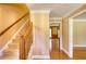 Inviting foyer with hardwood floors and a staircase leading to the upper level of the home at 4814 Riveredge Cv, Snellville, GA 30039