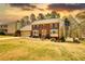 Charming brick two-story home with a two car garage, manicured lawn, and decorative blue shutters at 4814 Riveredge Cv, Snellville, GA 30039
