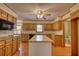 Well-equipped kitchen with wood cabinets, an island, and modern appliances at 4814 Riveredge Cv, Snellville, GA 30039