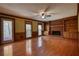 Comfortable living room with brick fireplace, built-in bookshelves, and access to an outdoor patio at 4814 Riveredge Cv, Snellville, GA 30039