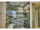 Luxurious shower featuring custom tile work, glass enclosure, and multiple shower heads at 4814 Riveredge Cv, Snellville, GA 30039