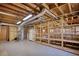 Unfinished basement with exposed wood framing, utilities, and concrete floor at 4814 Riveredge Cv, Snellville, GA 30039