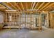 Spacious unfinished basement area with wooden framing and visible utilities at 4814 Riveredge Cv, Snellville, GA 30039