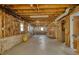 Unfinished basement showing insulation, wood frame, and utilities along the walls at 4814 Riveredge Cv, Snellville, GA 30039