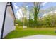 Spacious backyard perfect for outdoor activities with a level lot and wooded border at 5469 Helen Pl Sw, Mableton, GA 30126