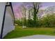 Spacious backyard that has a storage building in a grassy fenced-in area at 5469 Helen Pl Sw, Mableton, GA 30126