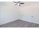 A bright bedroom with modern ceiling fan and attractive gray wood-look flooring at 5469 Helen Pl Sw, Mableton, GA 30126