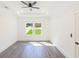 Bright bedroom features a tray ceiling, large windows and neutral decor at 5469 Helen Pl Sw, Mableton, GA 30126