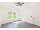 Bright bedroom features a tray ceiling, large windows and neutral decor at 5469 Helen Pl Sw, Mableton, GA 30126