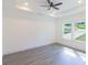 Bright bedroom features a tray ceiling, large windows and neutral decor at 5469 Helen Pl Sw, Mableton, GA 30126