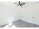 Bedroom featuring modern ceiling fan, wood-look floors, and white doors at 5469 Helen Pl Sw, Mableton, GA 30126
