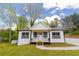 Charming home with freshly landscaped front yard and stylish curb appeal at 5469 Helen Pl Sw, Mableton, GA 30126