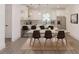 Modern kitchen with stainless steel appliances and an open dining area at 5469 Helen Pl Sw, Mableton, GA 30126