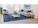 Cozy living room with a comfortable sofa, area rug, and a large picture window at 5469 Helen Pl Sw, Mableton, GA 30126