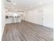 Bright, open concept living space with recessed lights, a kitchen, and gray laminate flooring at 5469 Helen Pl Sw, Mableton, GA 30126