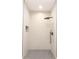 Modern tiled walk-in shower with a rainfall shower head at 5469 Helen Pl Sw, Mableton, GA 30126