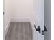A walk-in closet featuring modern white walls and stylish gray vinyl flooring at 5469 Helen Pl Sw, Mableton, GA 30126
