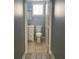 Bathroom with updated vanity, toilet, and neutral-toned tile flooring at 693 Dill Sw Ave, Atlanta, GA 30310