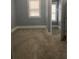 Neutral bedroom with gray walls, plush carpet, and a window with natural light at 693 Dill Sw Ave, Atlanta, GA 30310