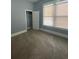 Bedroom featuring carpet, a window with blinds, and a closet at 693 Dill Sw Ave, Atlanta, GA 30310