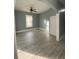 Bedroom featuring hardwood-style floors, gray walls, and natural light at 693 Dill Sw Ave, Atlanta, GA 30310