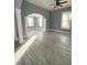 Living room featuring hardwood floors, gray walls, and an open floorplan at 693 Dill Sw Ave, Atlanta, GA 30310