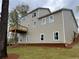 Exterior view of home with a deck, showcasing ample windows and fresh landscaping at 71 Dillard Ne Dr, Kennesaw, GA 30144