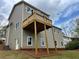 Back exterior featuring a spacious deck, perfect for outdoor entertaining and relaxation at 71 Dillard Ne Dr, Kennesaw, GA 30144