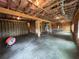 Unfinished basement with exposed beams and concrete floor at 71 Dillard Ne Dr, Kennesaw, GA 30144