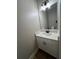 Modern powder room featuring vanity with white countertop and black hardware at 71 Dillard Ne Dr, Kennesaw, GA 30144