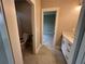Bright bathroom with a toilet room and a vanity with white countertop and cabinets at 71 Dillard Ne Dr, Kennesaw, GA 30144