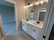 Bathroom featuring double sink vanity with white countertop and dark hardware at 71 Dillard Ne Dr, Kennesaw, GA 30144