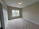 Carpeted bedroom featuring a window with natural light and neutral wall paint at 71 Dillard Ne Dr, Kennesaw, GA 30144