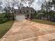 Beautifully designed home with a long driveway and fresh landscaping in a serene setting at 71 Dillard Ne Dr, Kennesaw, GA 30144