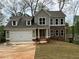 Charming two-story home featuring stone accents, a spacious garage, and a well-manicured front yard at 71 Dillard Ne Dr, Kennesaw, GA 30144
