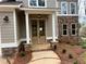 Inviting entrance with a double door, stone accents, and meticulous landscaping details at 71 Dillard Ne Dr, Kennesaw, GA 30144