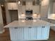 Spacious kitchen boasts a large island, stainless steel appliances, and stylish pendant lighting at 71 Dillard Ne Dr, Kennesaw, GA 30144