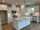 Modern kitchen featuring white cabinets, stainless steel appliances, and a center island at 71 Dillard Ne Dr, Kennesaw, GA 30144