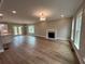 Spacious living room with fireplace, hardwood floors, and abundant natural light at 71 Dillard Ne Dr, Kennesaw, GA 30144