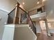 Elegant staircase features wood and metal accents, leading to the upper level at 71 Dillard Ne Dr, Kennesaw, GA 30144