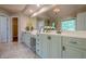 Bright bathroom features double vanity with plentiful counter space, a large mirror, and ample lighting at 7415 Northampton Ct, Cumming, GA 30040