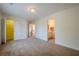 Spacious carpeted bedroom with walk-in closet, ensuite bathroom and neutral paint colors at 7415 Northampton Ct, Cumming, GA 30040