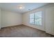 Simple yet comfortable bedroom featuring neutral carpeting, a bright window, and a closet at 7415 Northampton Ct, Cumming, GA 30040