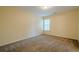 Carpeted bedroom featuring lots of natural light at 7415 Northampton Ct, Cumming, GA 30040