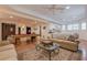 Comfortable entertainment room with a billiards table, kitchen area, and sectional sofa at 7415 Northampton Ct, Cumming, GA 30040