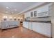 Kitchenette with white cabinetry, granite countertops, stainless steel appliances, and recessed lighting at 7415 Northampton Ct, Cumming, GA 30040